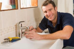 Plumber in Gaithersburg installs a bathroom faucet