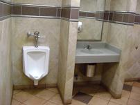 Urinal installation in a restaurant bathroom